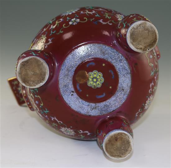 A Chinese famille rose ruby ground tripod censer, Jiaqing six character seal mark and of the period (1796-1820), height 27cm, damage an